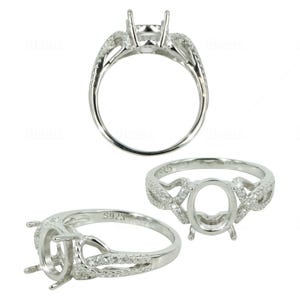 May include: A silver ring setting with a pave diamond band and an oval shaped center stone setting. The ring is marked "S925" on the band.
