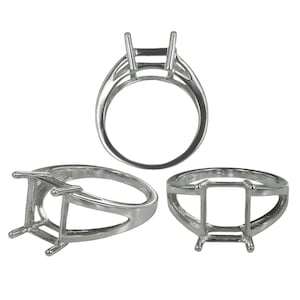 May include: A silver-colored metal ring setting featuring a four-prong head designed to hold a rectangular gemstone. The ring is shown from three different angles, displaying the open gallery structure and the smooth, polished band construction.