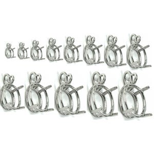 May include: A set of 12 silver-toned oval pendant bezel settings in various sizes. The bezels are designed to hold gemstones or other materials.