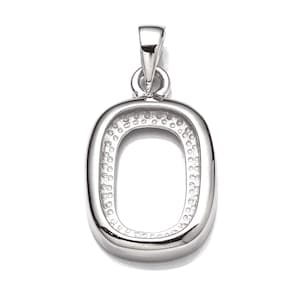 May include: A silver pendant shaped like the letter O. The pendant has a textured surface and a smooth, rounded edge.
