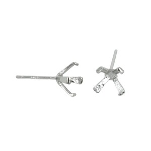May include: A pair of silver-colored metal earring settings featuring a four-prong basket design intended for holding a gemstone. Each setting includes a straight post and a clutch-ready back, showcasing a polished metallic finish and structure.