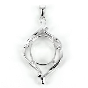May include: Silver pendant with a round, open space for a cameo or other decorative element. The pendant has a delicate, ornate design with swirling lines.