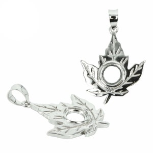 May include: Two silver maple leaf pendant settings for jewelry making. Each setting has a round opening for a stone or cabochon.