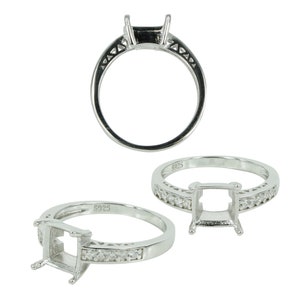 May include: Silver ring setting with a square shaped center stone setting and a row of small clear stones around the band. The ring is marked "925" on the inside of the band.