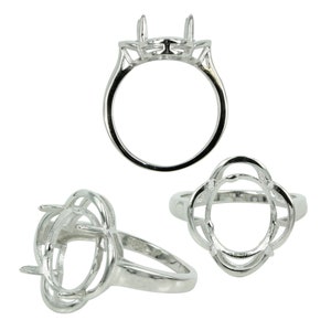 May include: Silver ring setting with an oval shaped bezel. The setting has a delicate, intricate design with multiple prongs.
