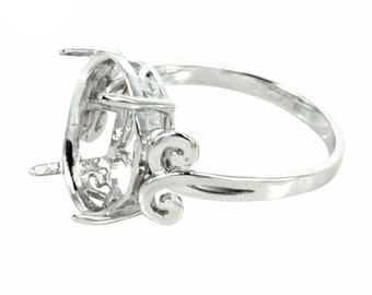 May include: Silver ring setting with an oval-shaped bezel and intricate filigree details. The setting is designed to hold a gemstone or other embellishment.