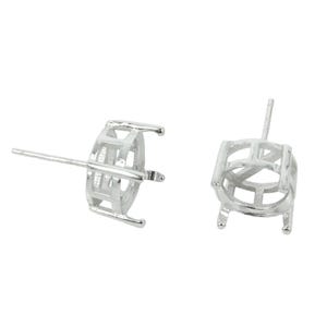 May include: Two silver earring settings with a round bezel and a post for attaching to an earring. The settings are designed to hold a round stone or cabochon.