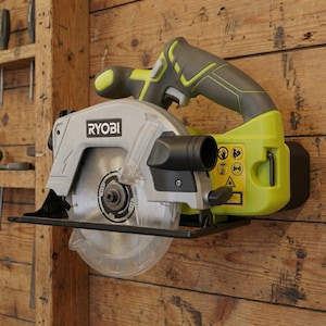 May include: A set of three ceramic mugs with a speckled, matte finish in cream, light grey, and dark grey. Each mug has a simple, minimalist design, suitable for coffee or tea.