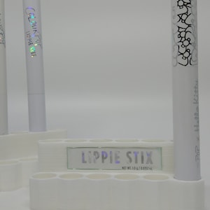 a group of white candles sitting next to each other