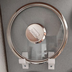 May include: A set of three ceramic mugs with a speckled, matte finish. The mugs are in shades of cream, light gray, and dark gray. Each mug has a simple, minimalist design and a rounded handle.