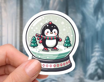 Adhesivo de vinilo resistente al agua de 2 pulgadas: pingüino patinando en una bola de nieve