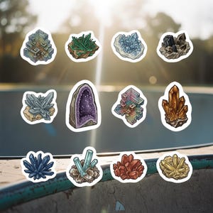 May include: A collection of colorful crystal stickers in various shapes and sizes. The stickers feature detailed illustrations of amethyst geodes, clusters of quartz, and other mineral formations in shades of purple, blue, brown, and green.