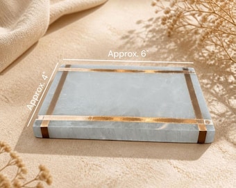May include: A rectangular light blue stone tray featuring two parallel metallic gold-colored bands across the surface. The tray measures approximately 6 inches in length and 4 inches in width as indicated by the text labels on the image.