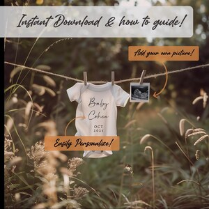 May include: A white baby onesie with the text "Baby Cohen OCT 2025" hanging on a clothesline in a field of tall grass. The onesie is personalized with a black and white ultrasound image.