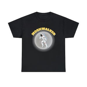 May include: Black t-shirt with a yellow graphic of an astronaut walking on the moon. The graphic has the text "MOONWALKER" around the moon.