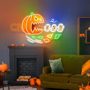 May include: A neon sign featuring an orange jack-o'-lantern with a jagged mouth, three white ghosts, and colorful leaves. The sign includes the text CN CUSTOM NEONSHOP in yellow. The design is mounted on a clear acrylic backing on a wall.