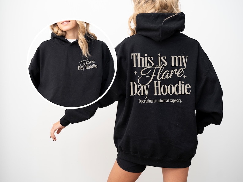 May include: Black hoodie with the text "This is my Flare Day Hoodie" on the back and "Flare Day Hoodie" on the front. The hoodie has a drawstring hood and a relaxed fit. The text "Operating at minimal capacity" is below the main text.