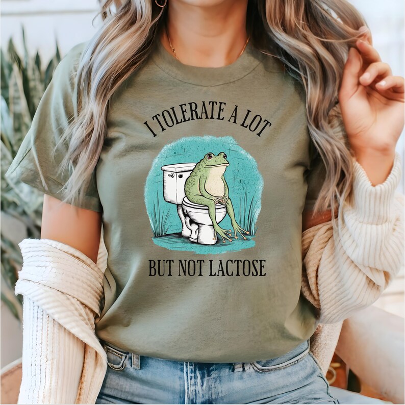 May include: A green t-shirt with a frog sitting on a toilet and the text "I tolerate a lot but not lactose".
