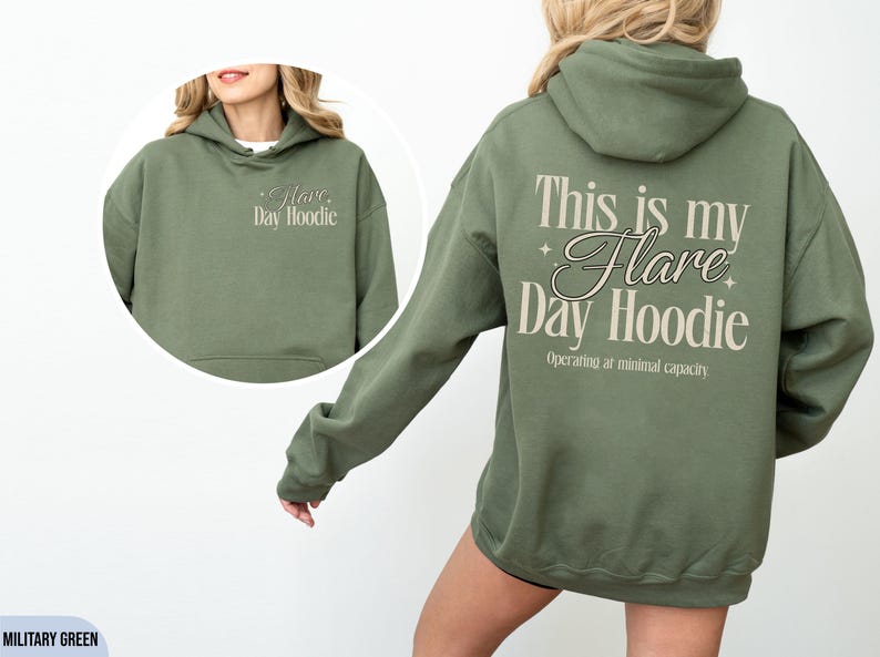 May include: Military green hoodie with the text "This is my Flare Day Hoodie" on the back and "Flare Day Hoodie" on the front. The hoodie has a drawstring hood and a front pocket.
