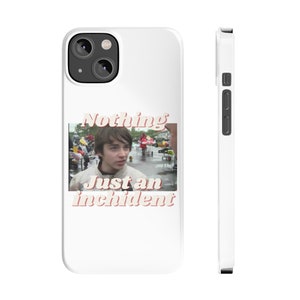 May include: White phone case with a film still and the text "Nothing Just an incident" in a retro font. The case has a glossy finish and a camera cutout on the back.