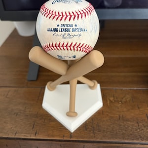 May include: A set of three ceramic mugs with a speckled, matte finish. The mugs are in shades of cream, light gray, and dark gray. Each mug has a simple, minimalist design, perfect for coffee or tea.