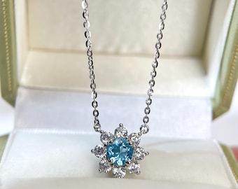 Blue Topaz Sunflower Pendant Necklace: Sterling Silver Floral Halo