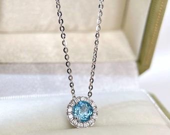 Blue Topaz Halo Necklace: Sterling Silver Birthstone Pendant