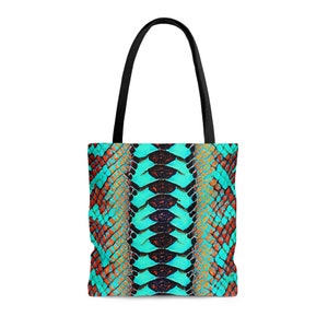 May include: A turquoise and orange tote bag with a snake skin pattern.
