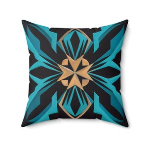 May include: A decorative cushion with a geometric pattern in shades of teal and gold. The pattern features a central star shape with radiating lines.