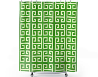 May include: Green and off-white geometric patterned shower curtain. The curtain features a repeating Greek key design in a vibrant green color, creating a bold and stylish look. The curtain is designed to hang from a standard shower rod.