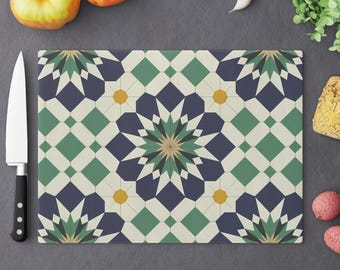May include: A decorative cutting board with a geometric pattern in shades of blue, green, and yellow. The pattern features a repeating design of stars and diamonds.