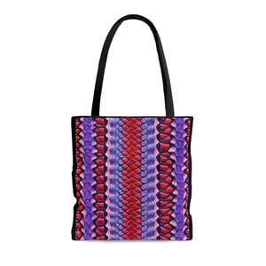 May include: A black tote bag with a purple and red snake skin pattern.
