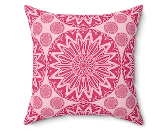 May include: Pink throw pillow with a repeating pattern of pink and white mandala designs.