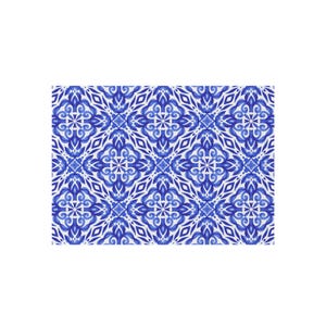May include: A rectangular pattern featuring a repeating design of blue and white floral and geometric shapes. The pattern has a symmetrical layout with a detailed, ornate appearance, suitable for textiles or decorative applications.