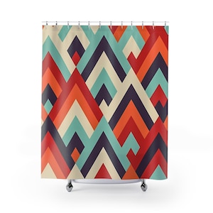 May include: A colorful shower curtain with a geometric pattern. The design features a repeating pattern of chevron shapes in red, orange, teal, cream, and dark purple. The curtain hangs from a metal rod with silver hooks.