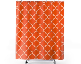 May include: Orange shower curtain with a white geometric pattern. The pattern is a repeating design of squares with rounded corners.