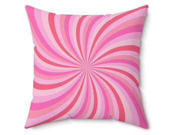 May include: Pink and red striped throw pillow with a swirling pattern.