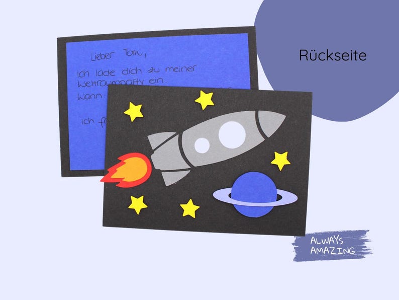May include: A black card with a rocket, stars, and a planet on a dark blue background. The text "R&uuml;ckseite" is on the top right corner of the card. The text "ALWAYS AMAZING" is on the bottom right corner of the card.