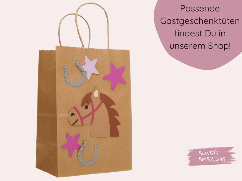 May include: A brown paper gift bag decorated with a horse head, stars, and horseshoes. The bag has a white background with the text "Always Amazing" in pink.