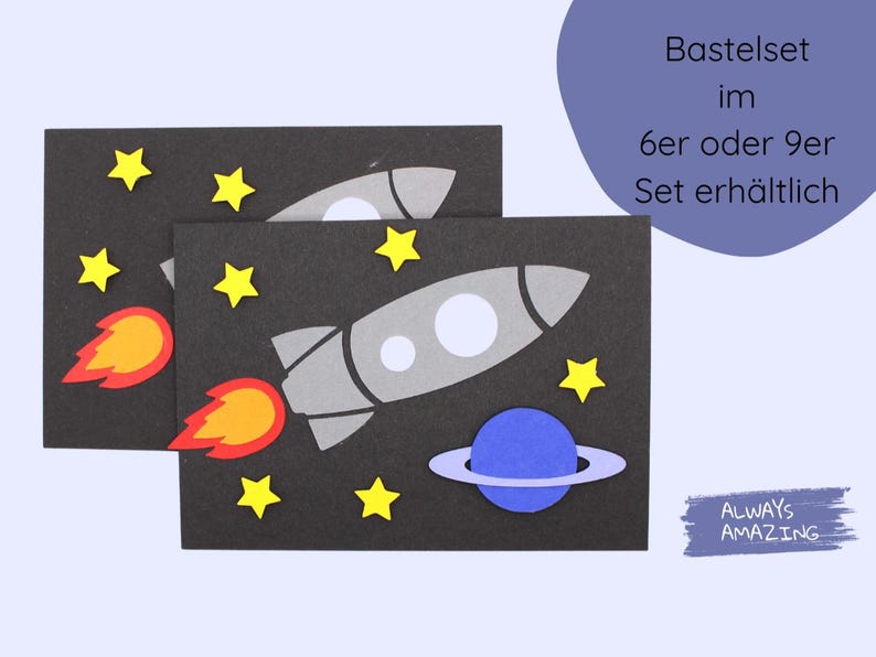 May include: A craft set with two black cards featuring a rocket ship, planets, and stars. The text on the card reads "Basteleset im 6er oder 9er Set erh&auml;ltlich". The text "ALWAYS AMAZING" is on a purple background.