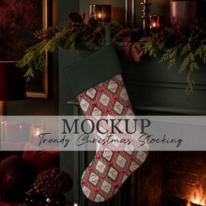 May include: A Christmas stocking featuring a repeating pattern of diamond shapes containing Santa Claus and candy cane illustrations on a red and green striped background, with a solid dark green cuff and a hanging loop at the top.