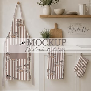 May include: A kitchen apron and a matching oven mitt featuring a repeating pattern of vintage bicycles with baskets on a background of vertical brown and white stripes. The apron includes a solid brown front pocket and adjustable neck straps.