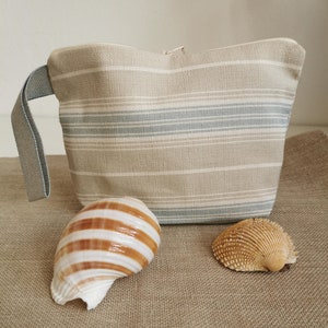 Pochette a righe in cotone, colori del mare, porta con te skin care, solari e make-up, perfetta per la borsa o le vacanze estive.
