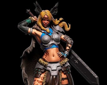 May include: A female warrior figurine with blonde hair, wearing a blue and silver armor, a brown leather skirt, and holding a sword. She has tattoos on her legs and is standing on a rock.