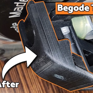 May include: Close-up of a black plastic part with a textured surface. The part is labeled "Begode T4" in orange text. The part is attached to a larger object, possibly a scooter or electric skateboard.