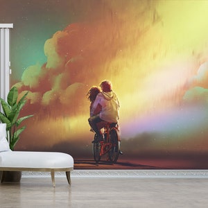 May include: A couple rides a bicycle together against a colorful sunset sky with clouds and stars. The sky is a mix of orange, yellow, green, and purple.