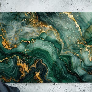 May include: Rectangular cutting board with a green and gold marble design. The board features swirling patterns of emerald green and gold, creating a luxurious aesthetic. Ideal for kitchen use, this board adds a touch of elegance to food preparation.