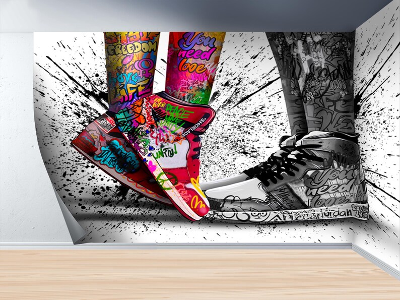 May include: A pair of sneakers with colorful graffiti designs, including the words "Freedom", "You Need Love", and "Air Jordan".