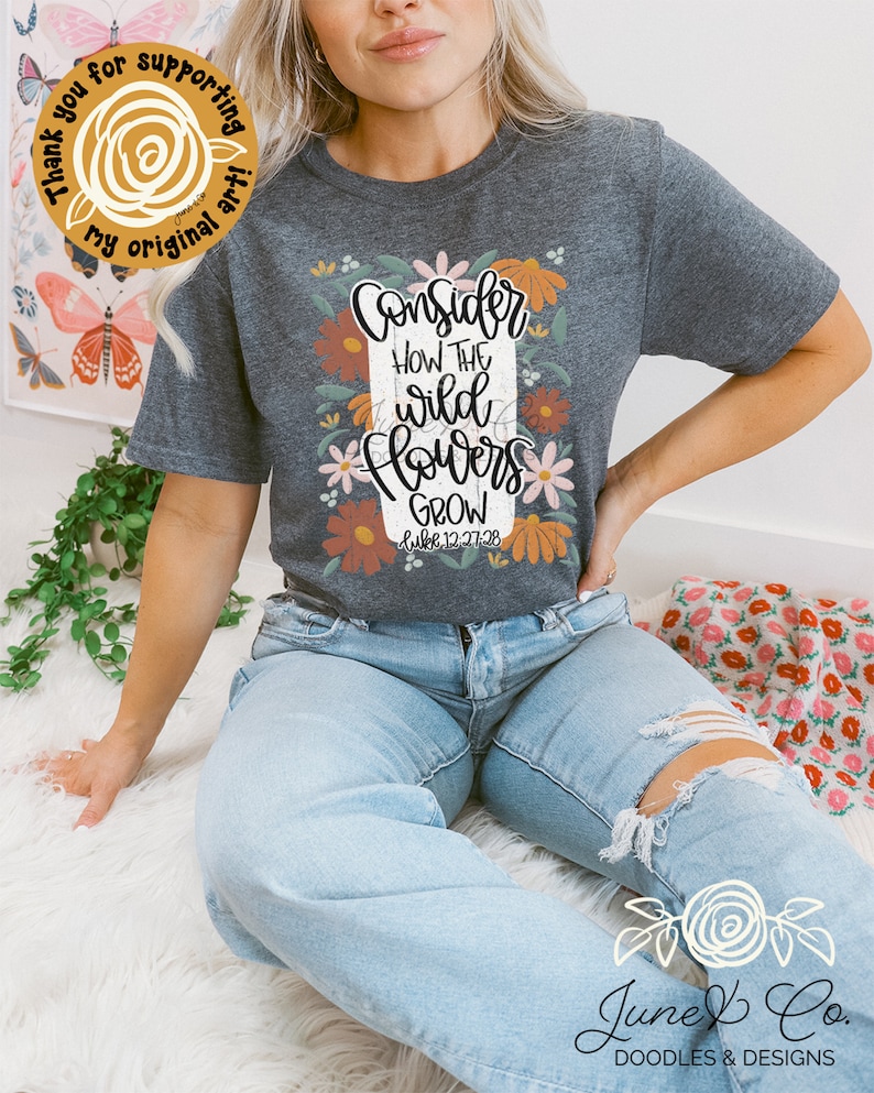 May include: A gray t-shirt with a floral design and the text "Consider how the wild flowers grow Luke 12:27-28".