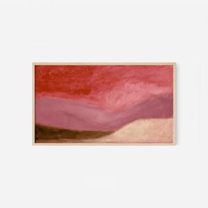 Pode incluir: Pintura abstrata de paisagem emoldurada em madeira. A obra apresenta um gradiente de cores, com tons de vermelho, rosa e castanho. A pintura tem uma aparência texturizada, sugerindo pinceladas ou técnica semelhante.